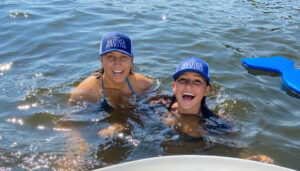 Boat club members are all smiles during a sunny day on the water with Bridge Marina.