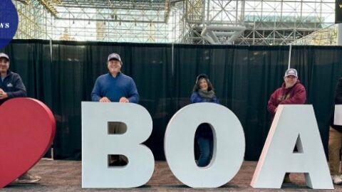 Smiling Bridge Marina team members at the New York Boat Show holding an ‘I heart Boats’ display at the Javits Center in New York City