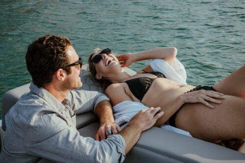 Couple on a Four Winns boat enjoying the sun on Lake Hopatcong.