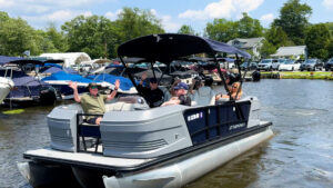 Group enjoying a sunny day on a Bridge Marina pontoon rental on Lake Hopatcong, NJ.