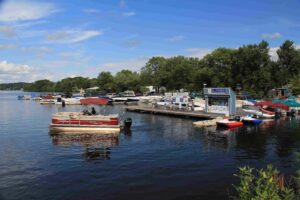 Rental pontoon from Bridge Marina approaches docks on Lake Hopatcong