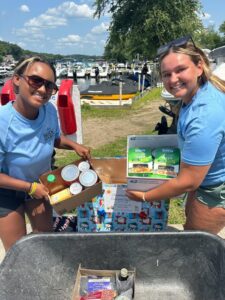 Two Bridge Marina team members collect food donations on the docks.