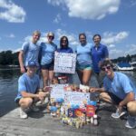 Team members at Bridge Marina on Lake Hopatcong with food donations collected for Sparta Food Pantry