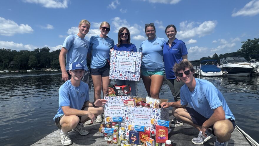 Team members at Bridge Marina on Lake Hopatcong with food donations collected for Sparta Food Pantry
