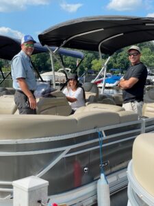 Instructor John Crisp and Bridge Marina Boating Club members practice docking on Lake Hopatcong
